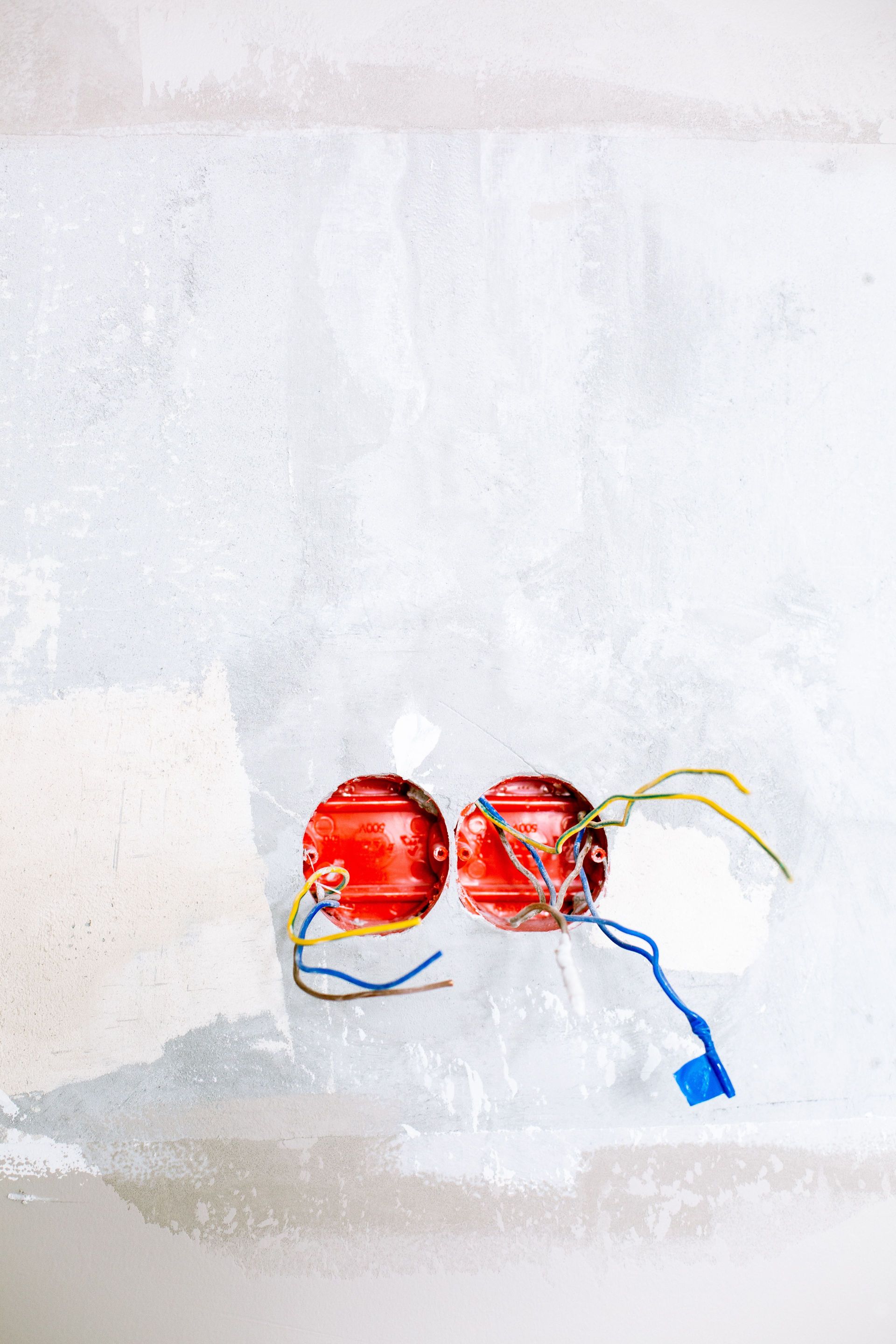 Close-up of electrical wiring and sockets in a home renovation project.